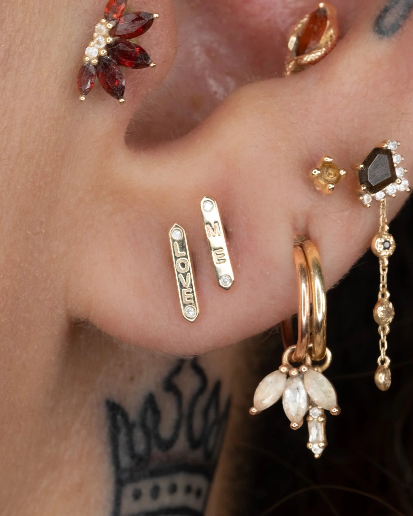 Close-Up of “LOVE” Diamond Bar Showing Soft Gold Finish