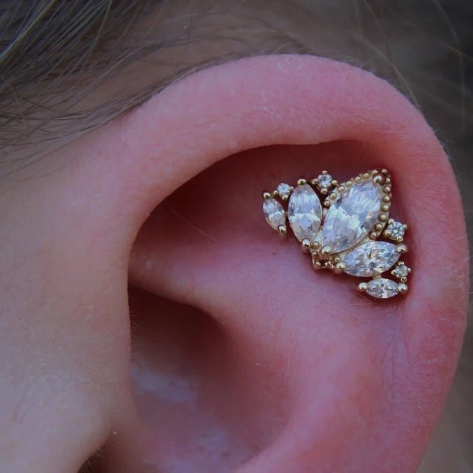 Close-Up of Pear and Round CZs with Gold Beading in Queen Naveen