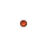 Close-up of fiery gemstone stud in solid gold setting