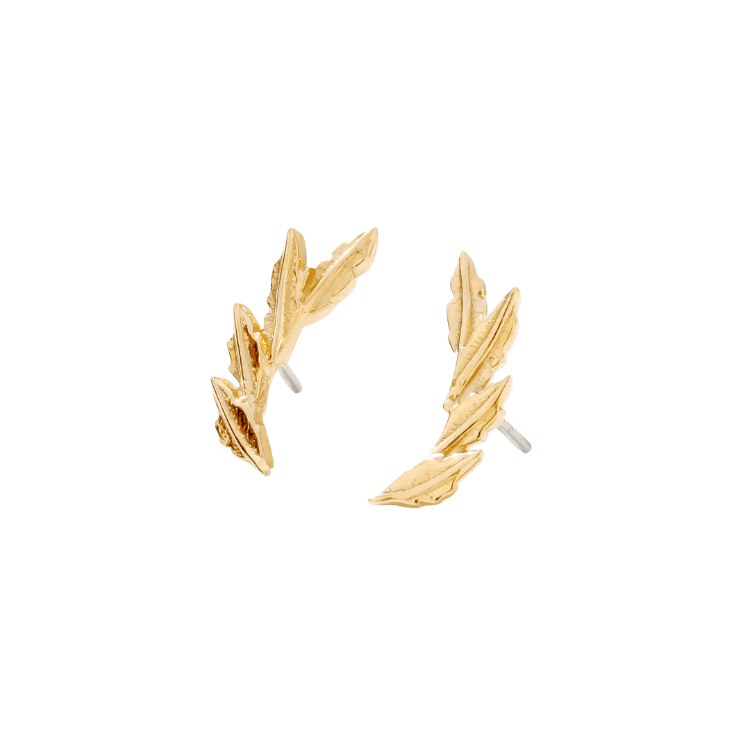 Close-up of gold laurel leaf pin for lobe piercings