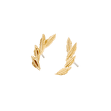 Close-up of gold laurel leaf pin for lobe piercings