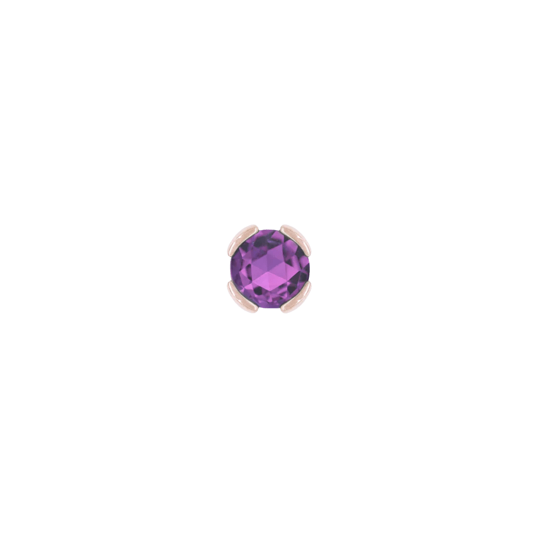 Close-up of rich purple amethyst set in solid gold