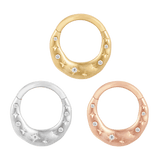 Close-up of star-inspired 14K gold clicker with CZs