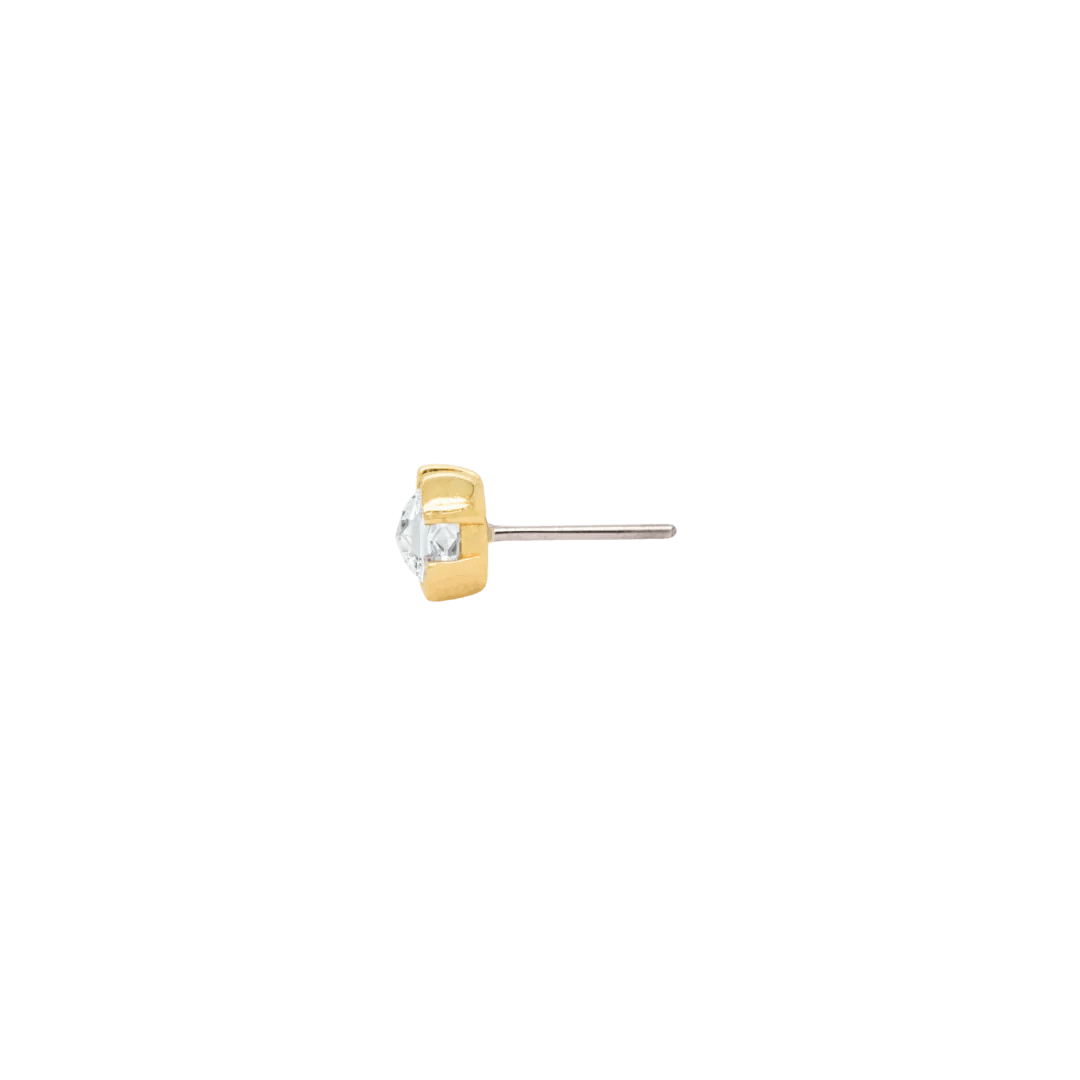 Flat-lay of 14k gold Peekaboo stud – elegant and compact CZ end