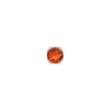 Macro image of bright orange garnet in minimalist bezel