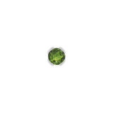 Macro shot of rose-cut green tourmaline set in solid gold bezel