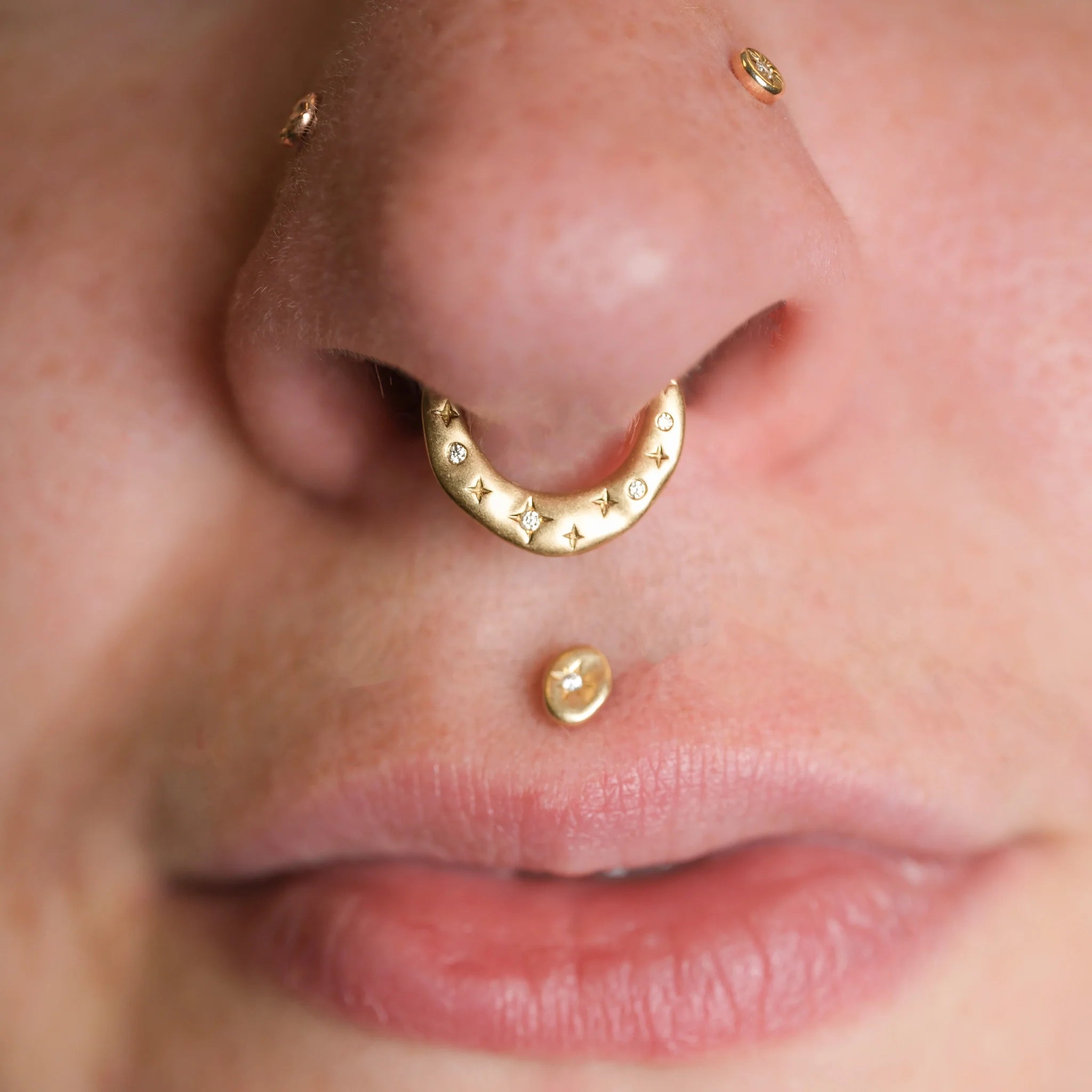 Minimalist 16G gold clicker with constellation-style stones