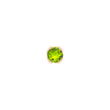 Side view of elegant gold threadless stud with peridot gemstone