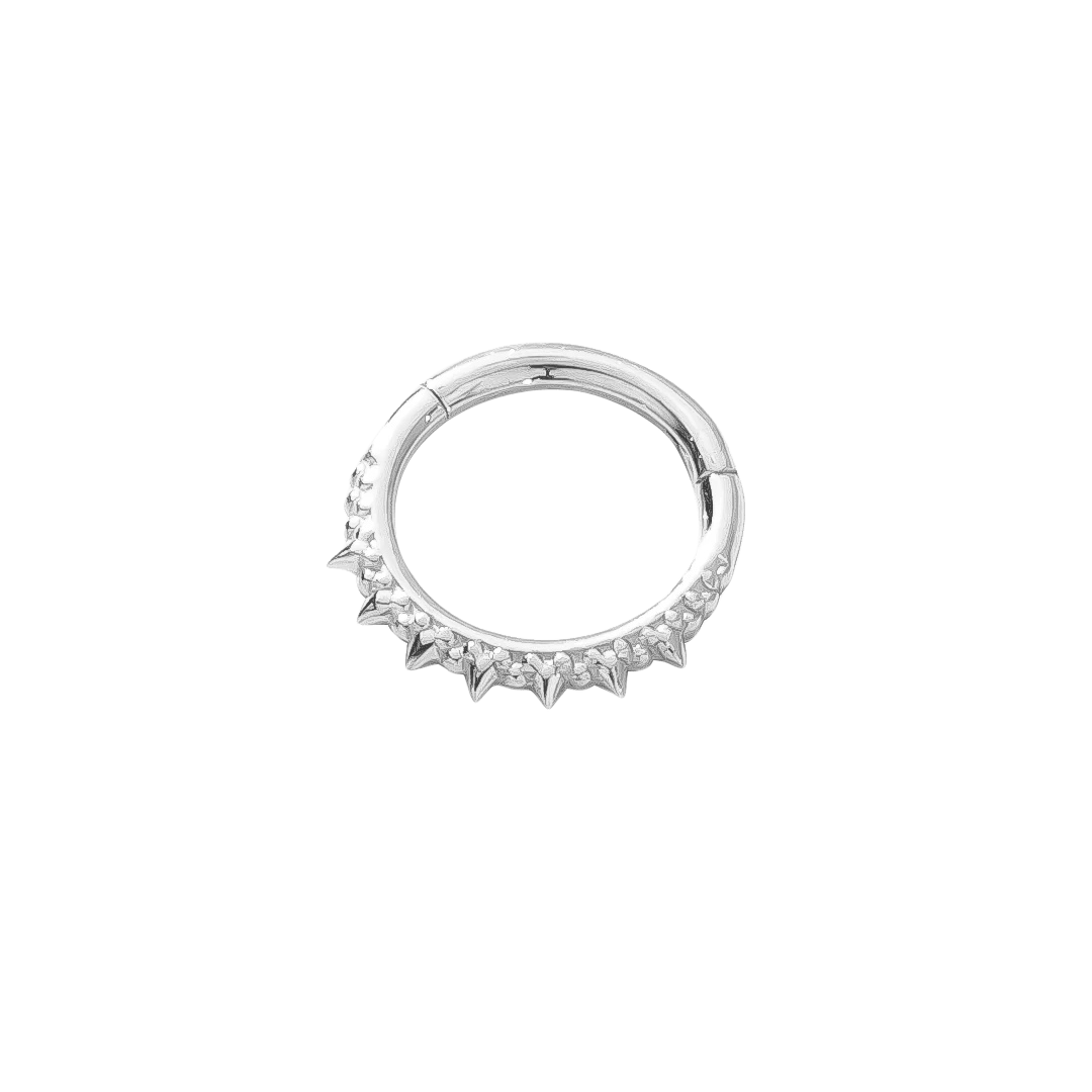 Spiked 14K septum clicker styled in ear piercing