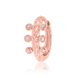 Close-up of Rora clicker in rose gold – six small CZ stones across the band