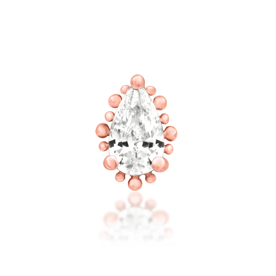 Side angle of Ennvi in rose gold – halo detail with faceted CZ center
