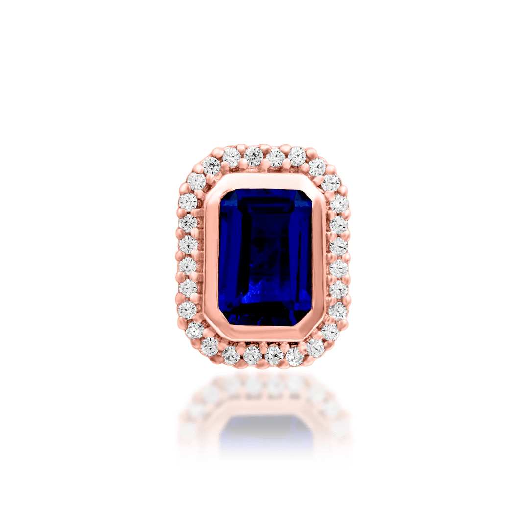 Elegant gold piercing jewelry with blue gemstone
