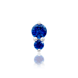 Front view of Aman in white gold – vertical design with vibrant blue sparkle