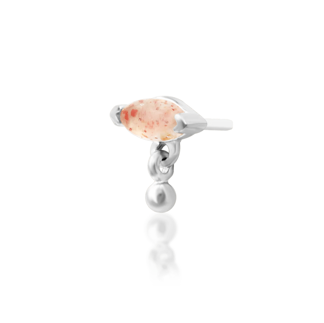 Macro image of Amanda decorative end – polished 14k gold and gemstone detail