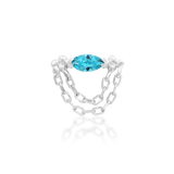 Gold piercing jewelry with dangling chain and blue gemstone