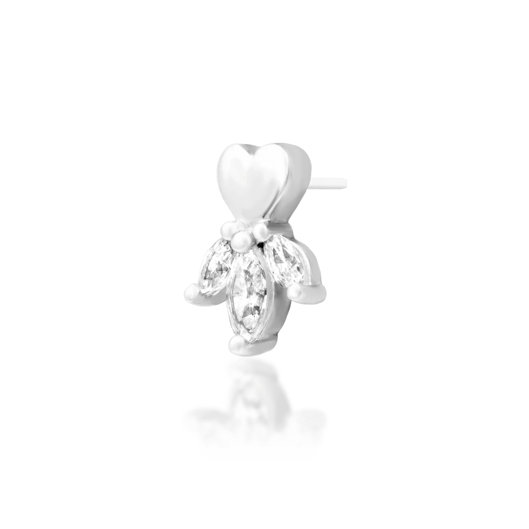 Macro shot of Revive decorative end – gold heart and shimmering CZ wing