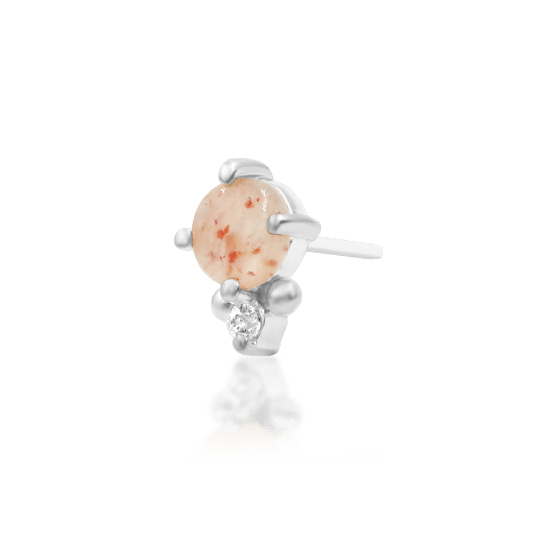 Macro shot of Rosalind end – polished gold and delicate gemstone pairing