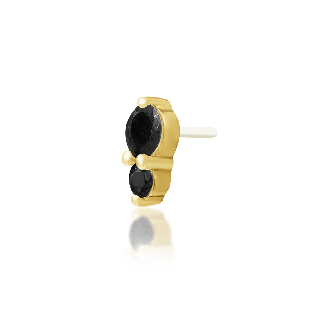 Top-down image of Aman – 3mm and 2mm CZ alignment in gold setting