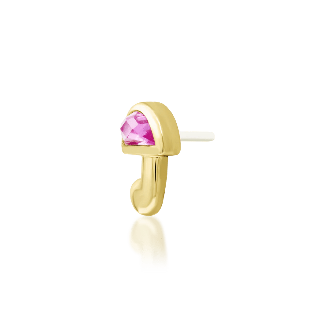 Top-down image of Kinoko – pink gemstone centered on sculptural gold
