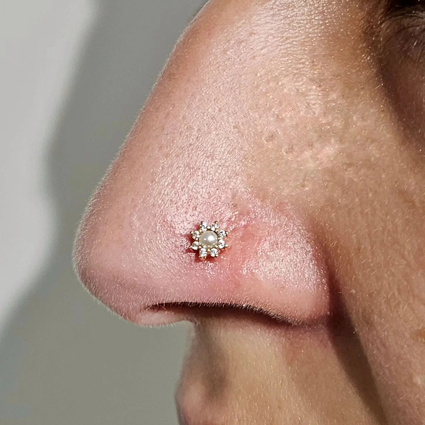 Close-Up of Pearl Surrounded by Swarovski CZs – Macro Shot

