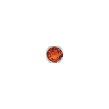 Close-up of fiery gemstone stud in solid gold setting