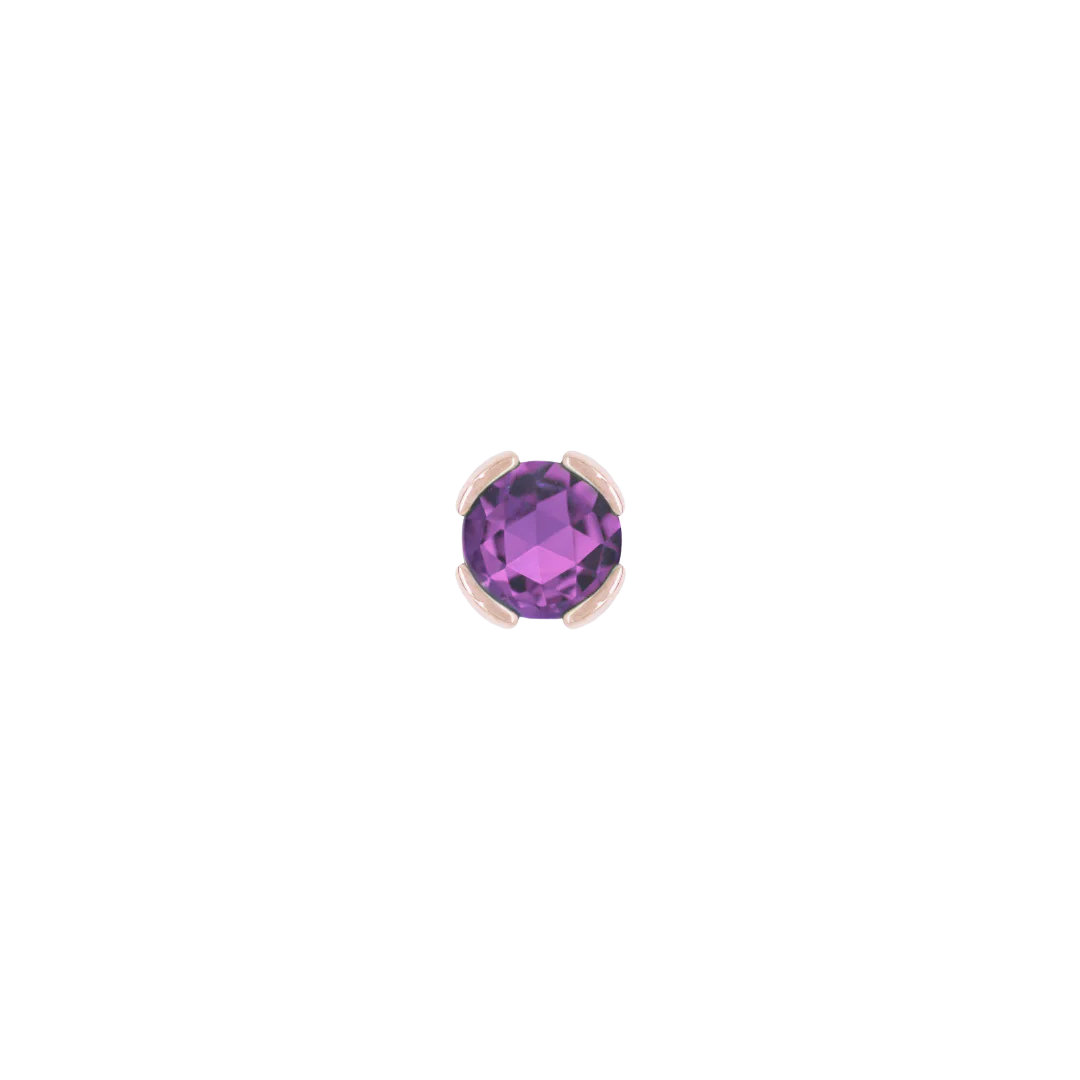 Close-up of rich purple amethyst set in solid gold