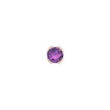 Close-up of rich purple amethyst set in solid gold