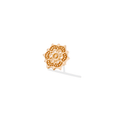 Flat lay of lotus piercing pin with delicate cutout details