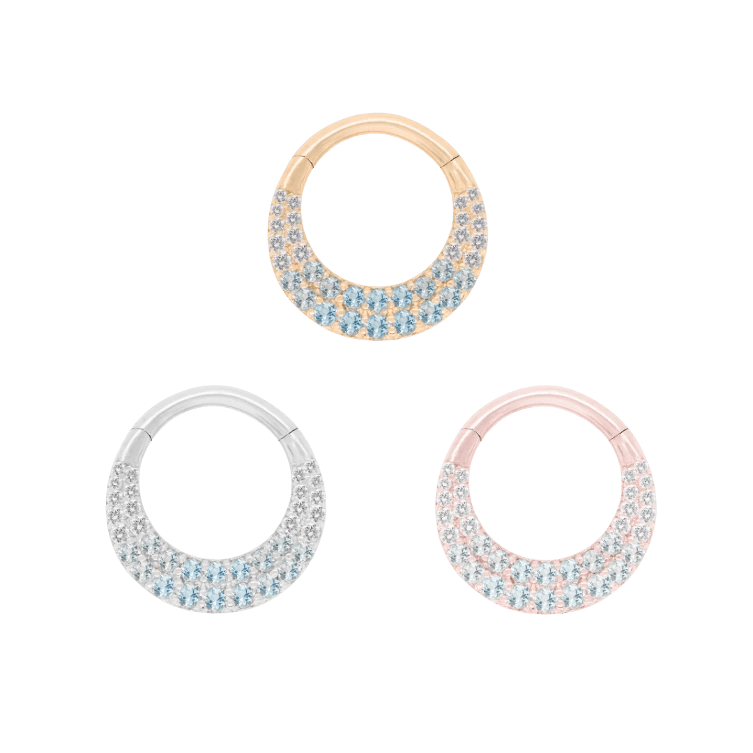 Close-up of blue topaz gradient on Metamorphosis 14k gold clicker ring