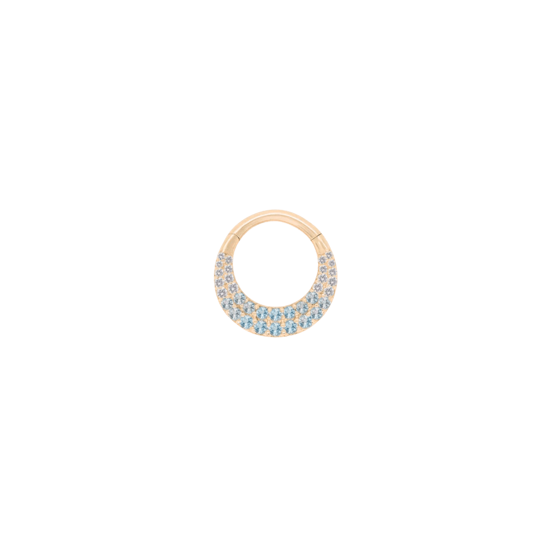 Metamorphosis clicker ring in 14k yellow gold with ombré blue topaz gemstones

