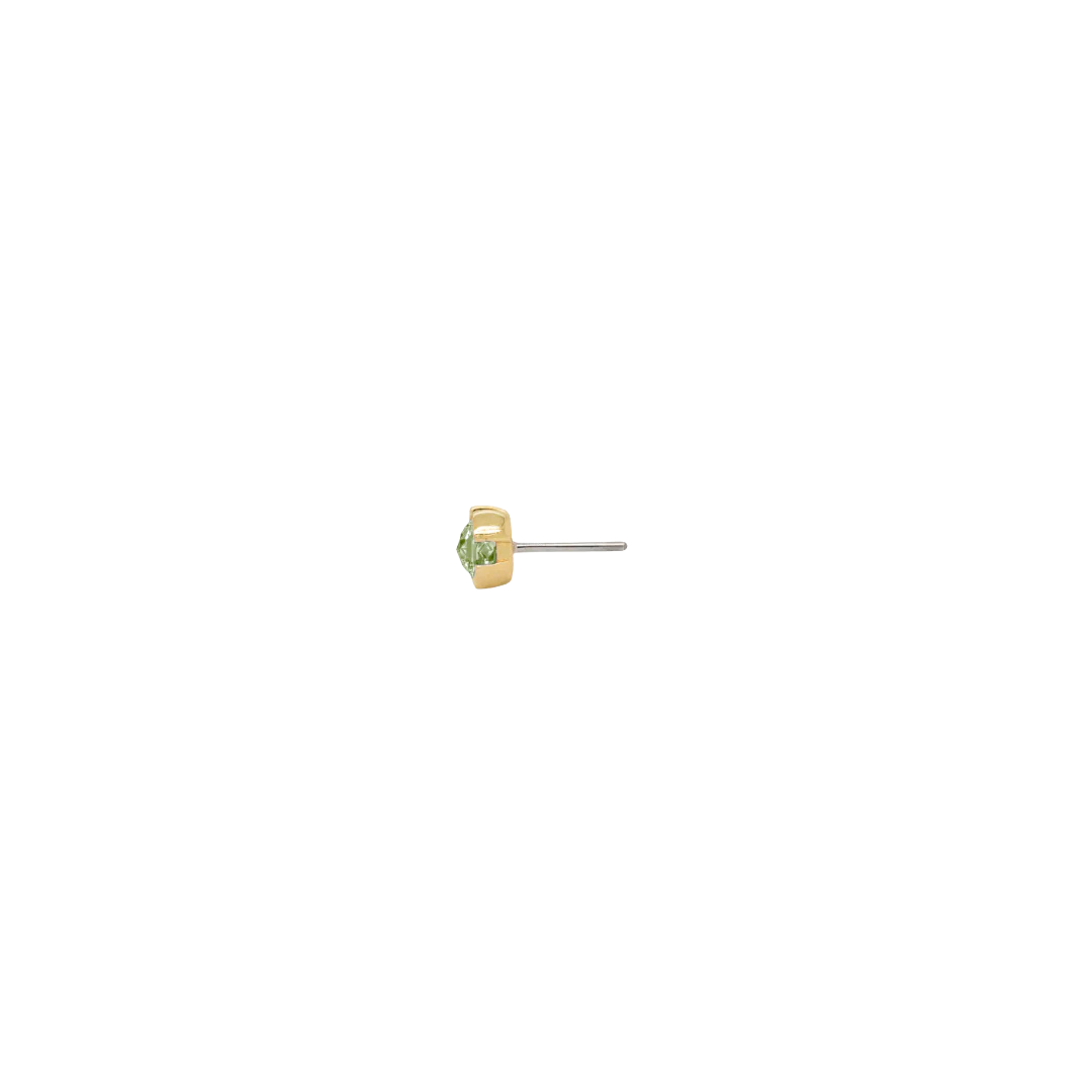 Flat-lay of Peekaboo peridot threadless end in 14k gold