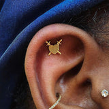 Gold piercing end shaped like a fractured heart