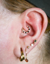 Eclipse Black Spinel & CZ Clicker – 14K Gold Piercing Ring - piercing - zone.com