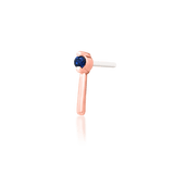 Styled piercing photo with Vast end – subtle sapphire accent in ear