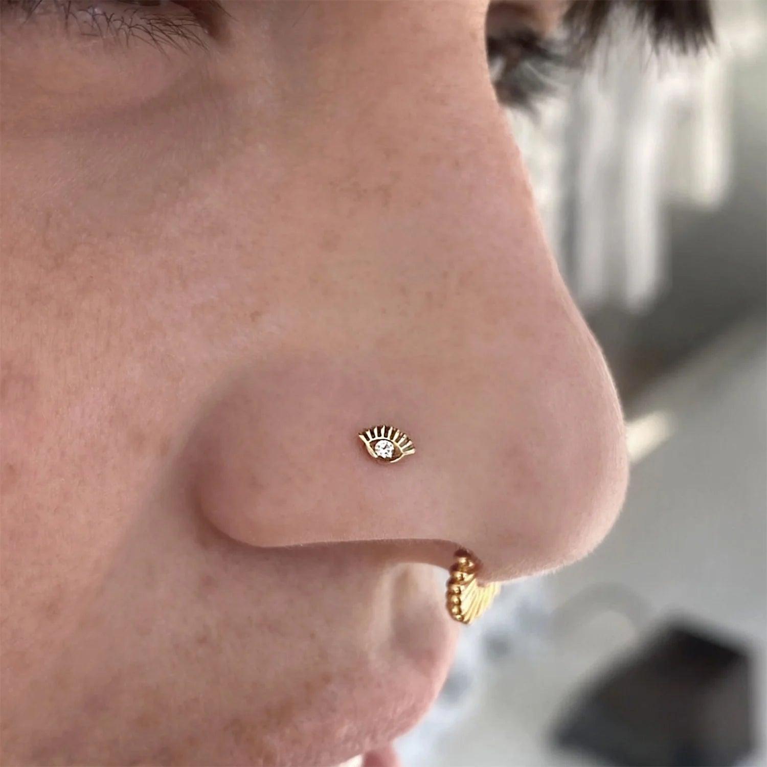14K gold eye-shaped threadless end with Swarovski CZ